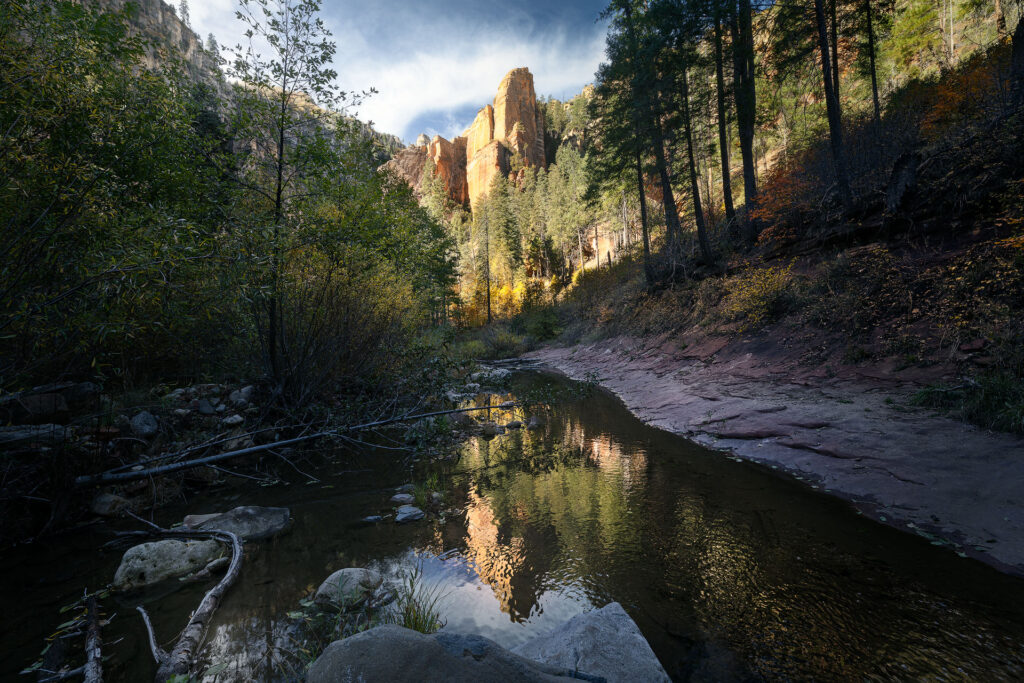 a large rock face looms deep in n Arizona canyon