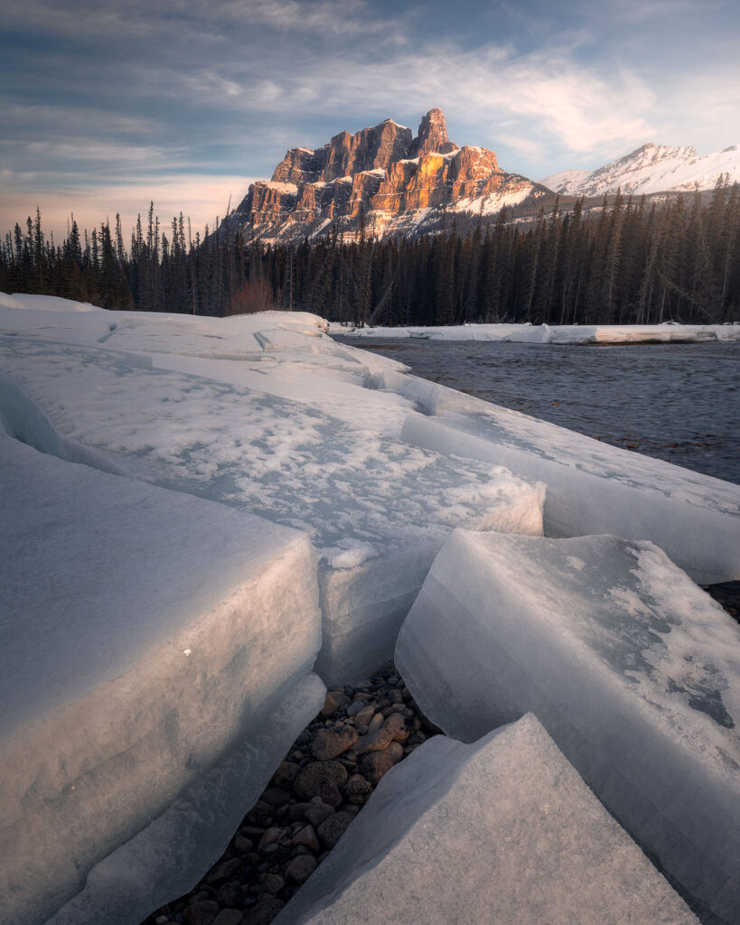 Castle Mountain over large blocks of ice at sunrise