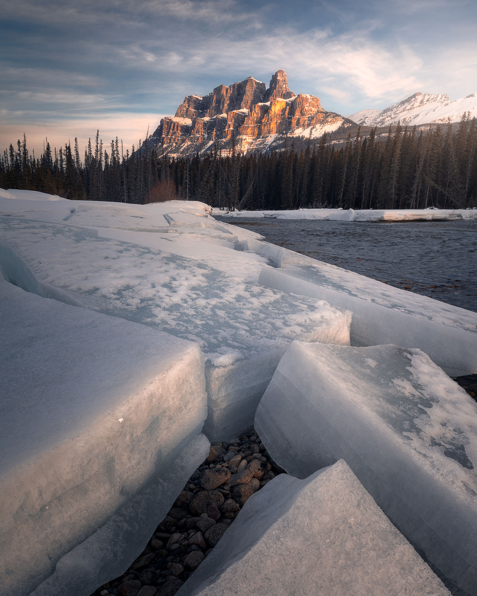 Cracked-2026-P Castle Mountain over large blocks of ice at sunrise