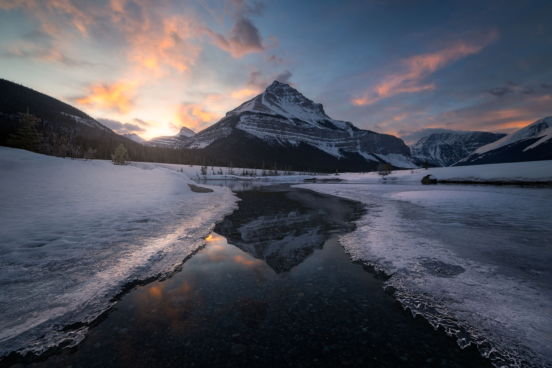 Crispy Dawn-2026-P Beautiful cotton candy skies over a mountain reflected in water and ice